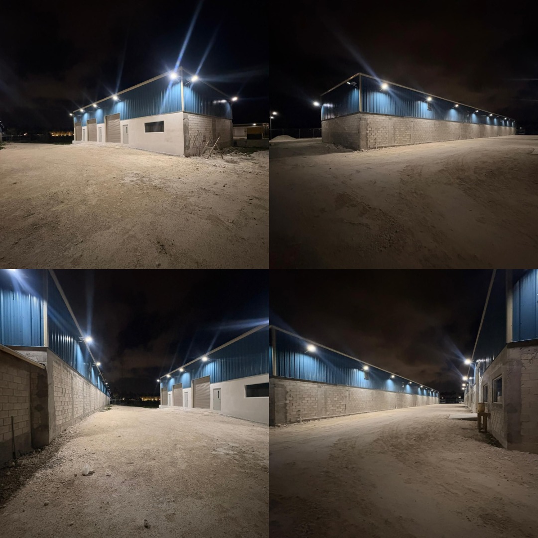 Solar lights illuminating warehouse corridor